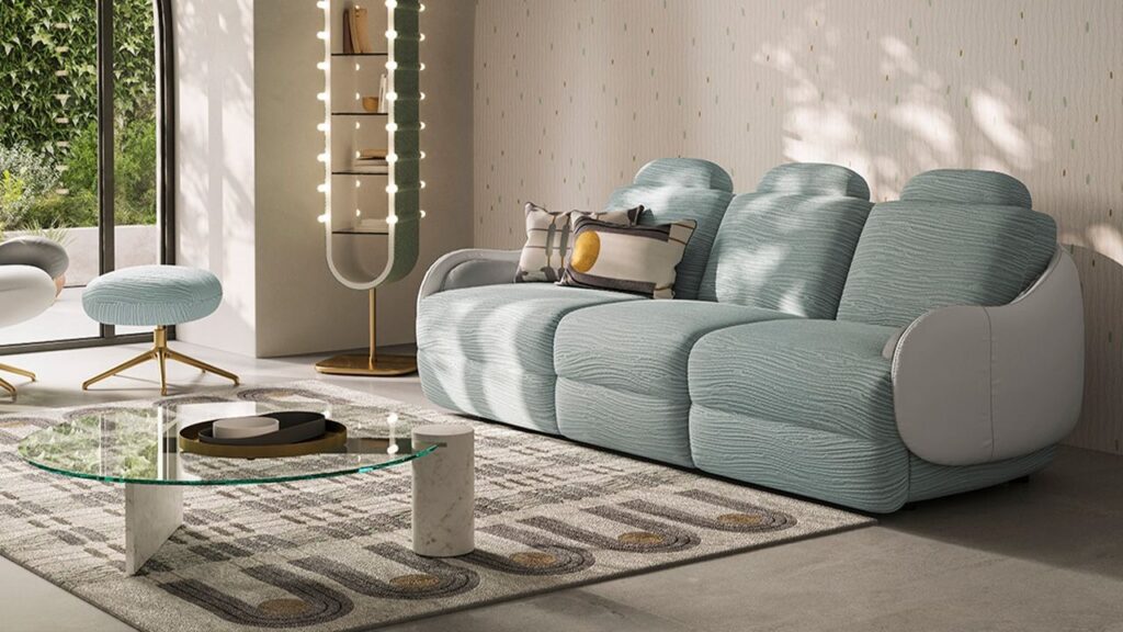 Calilla sofa by Natuzzi Italia with leather external frame and BYBORRE Coral fabric seat and backrest, featuring brass-plated metal base, displayed in Royal Oak, Michigan.