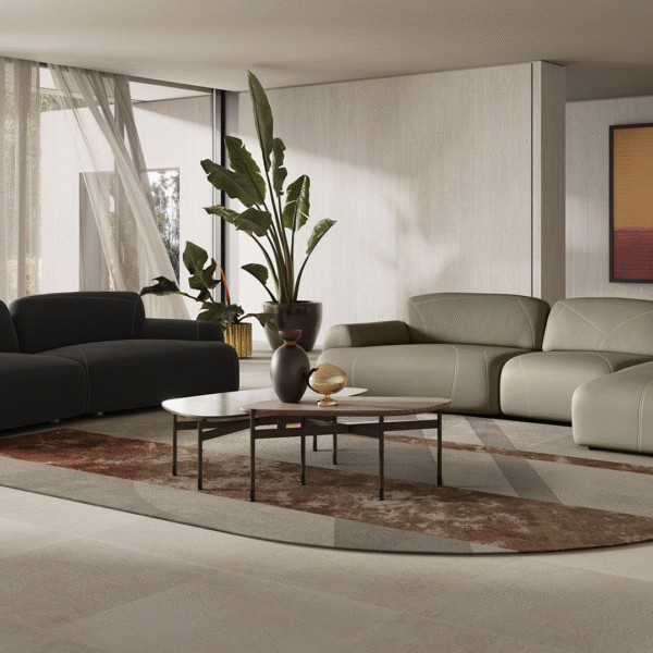 Buddy modular sofa by Natuzzi Italia in soft beige fabric, featuring overlapping geometric shapes and low-profile design, displayed in Royal Oak, Michigan showroom.