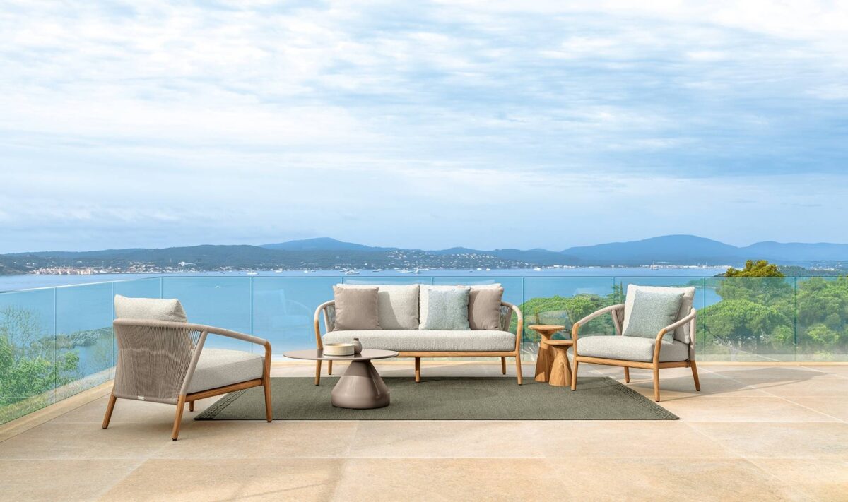 Talenti Parker Sofa, combining natural teak wood with soft fabric cushions for a refined outdoor seating experience.