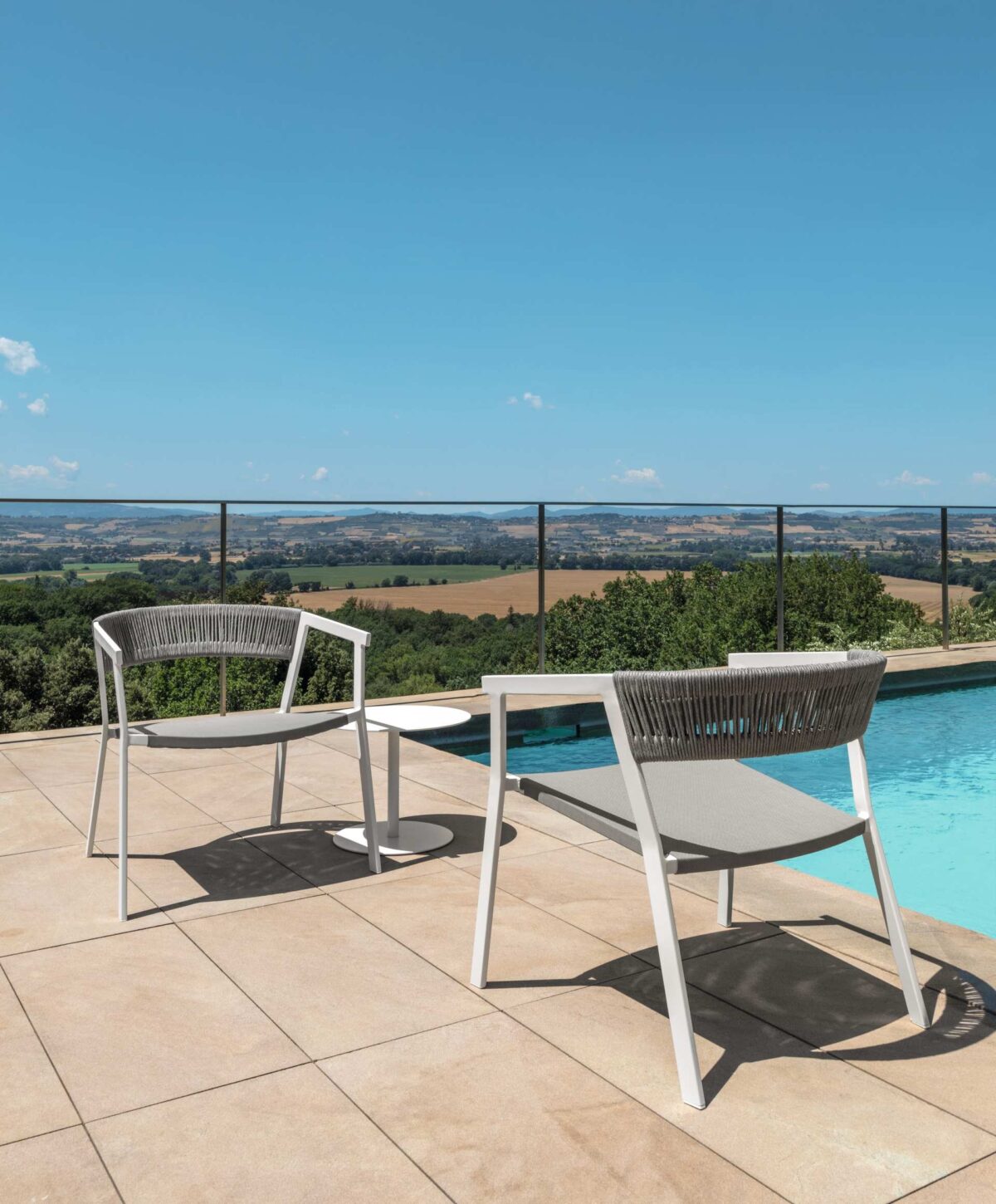 Contemporary Key Living Armchair by Talenti featuring clean lines and plush seating for outdoor lounging
