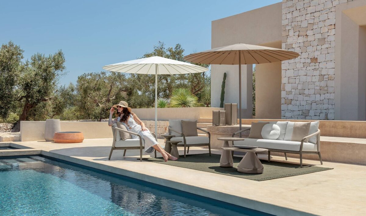 Parker Sofa by Talenti, ideal for modern patios and terraces, offering comfort and style with its teak frame and fabric cushions.