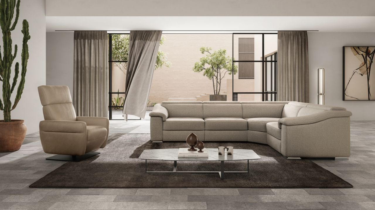 Brick sofa by Natuzzi Italia with leather upholstery and reclining headrests, displayed in Royal Oak, Michigan.
