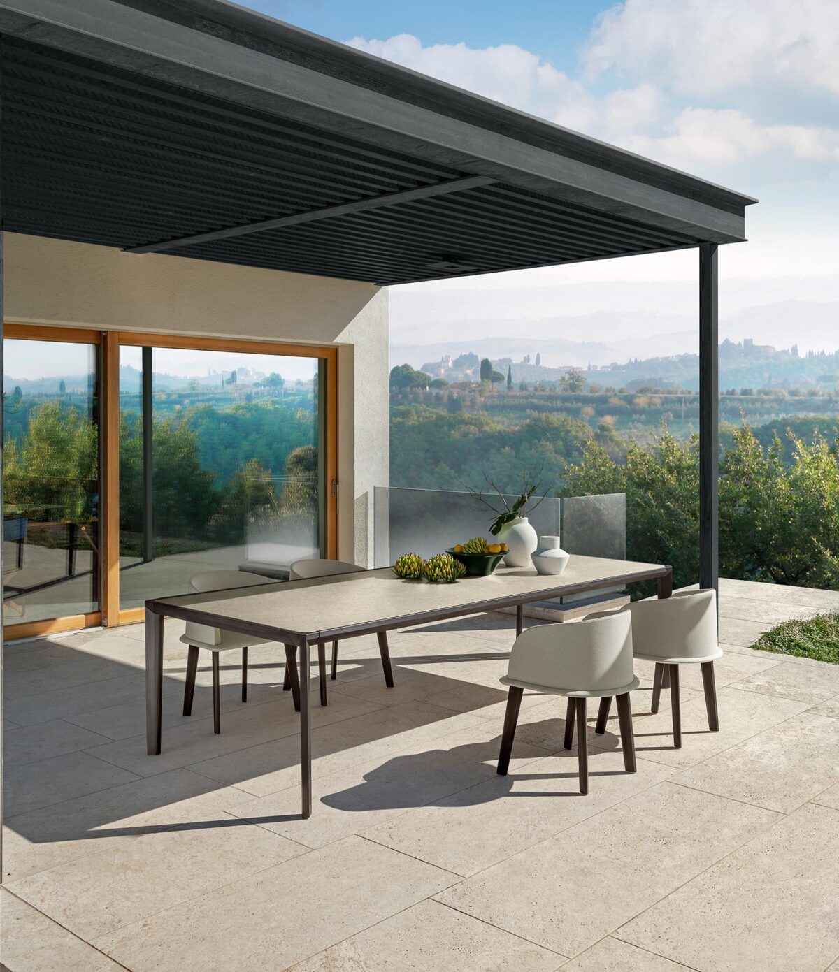 CleoSoft Wood Tube Chair at Italcasa Design in Troy. A padded, teak-framed Italian chair perfect for luxurious, modern outdoor dining.