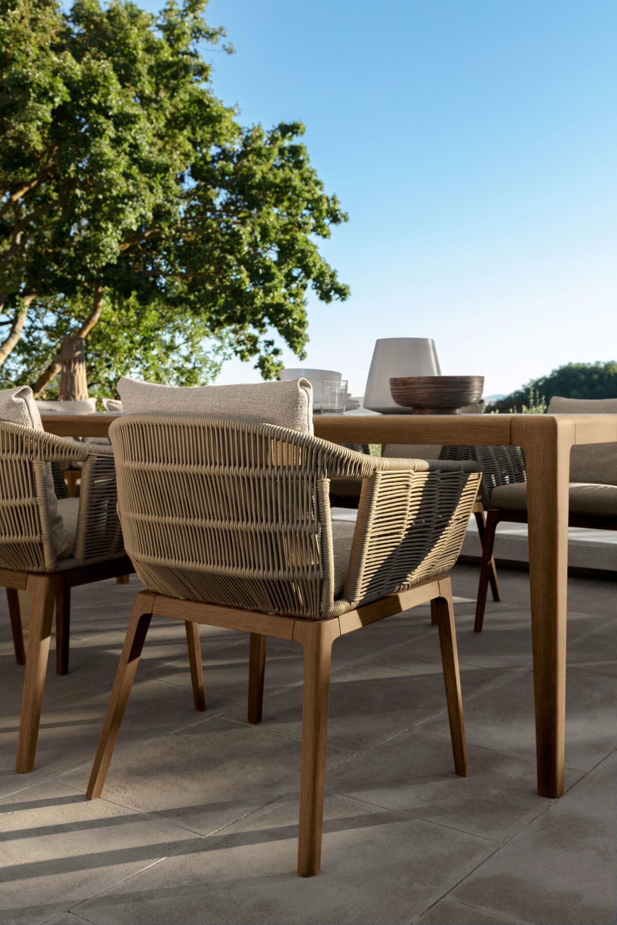 Modern Cruise Teak Dining Chair by Talenti offering warm wood tones and comfortable seating for Troy, Michigan gardens