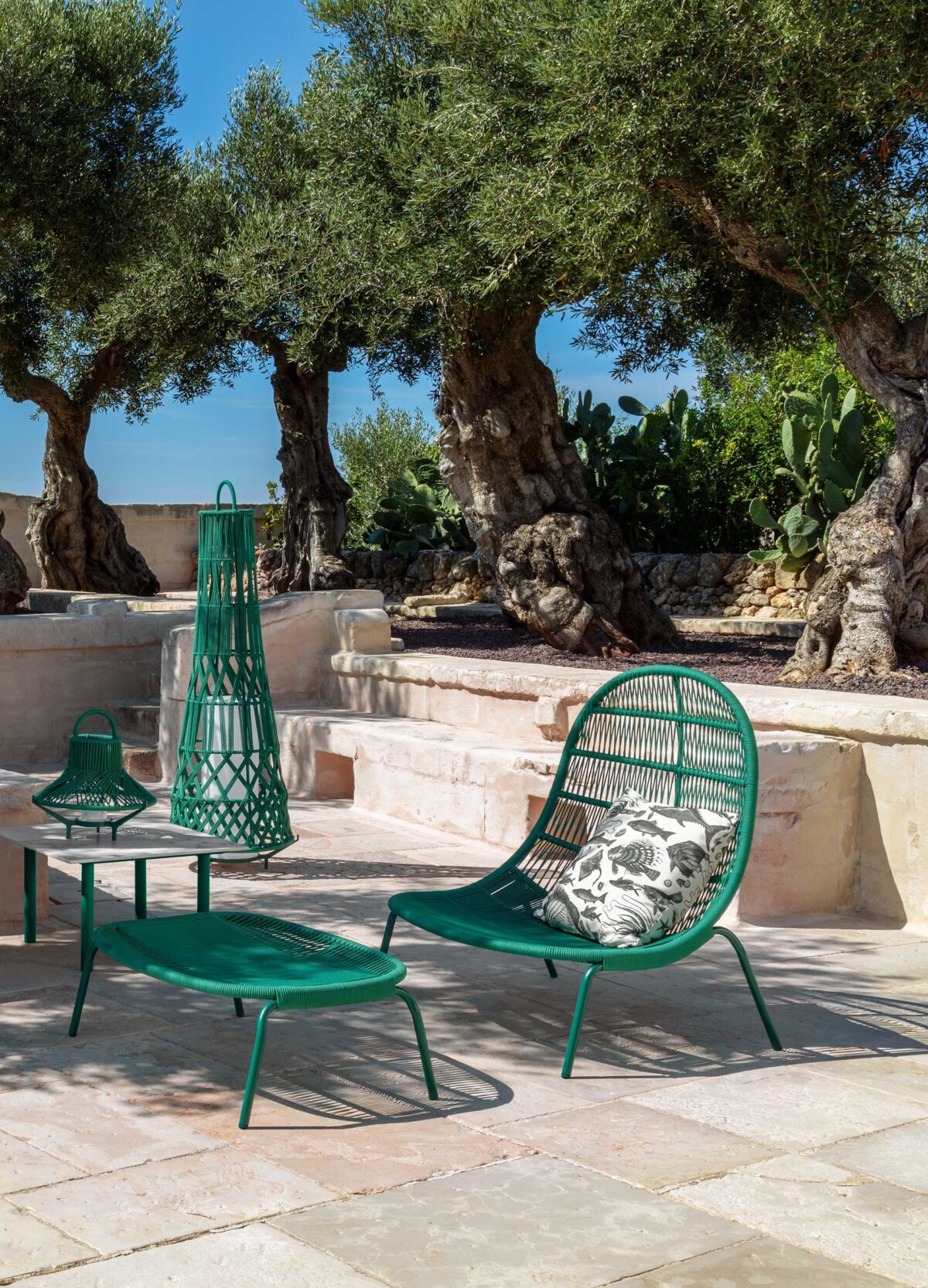 High-end Panama Lounge Armchair by Talenti showcasing craftsmanship and comfort in a luxury garden setting