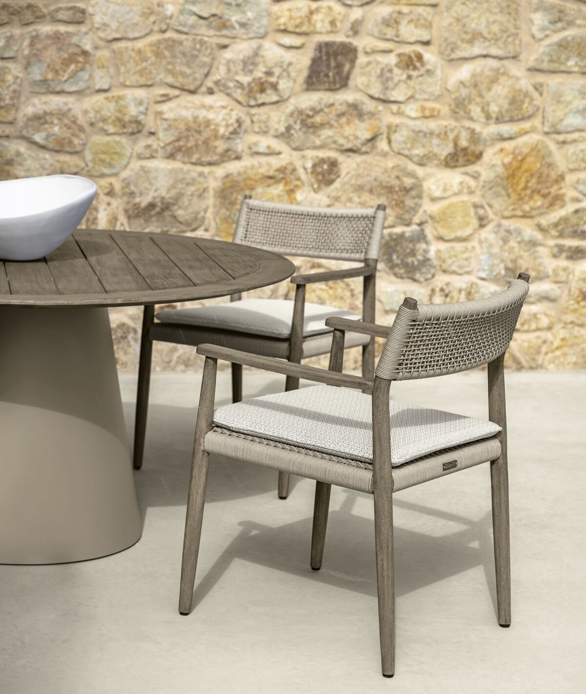 "Outdoor-ready Coral Living Armchair by TalentiSpa with elegant lines and durable fabric."