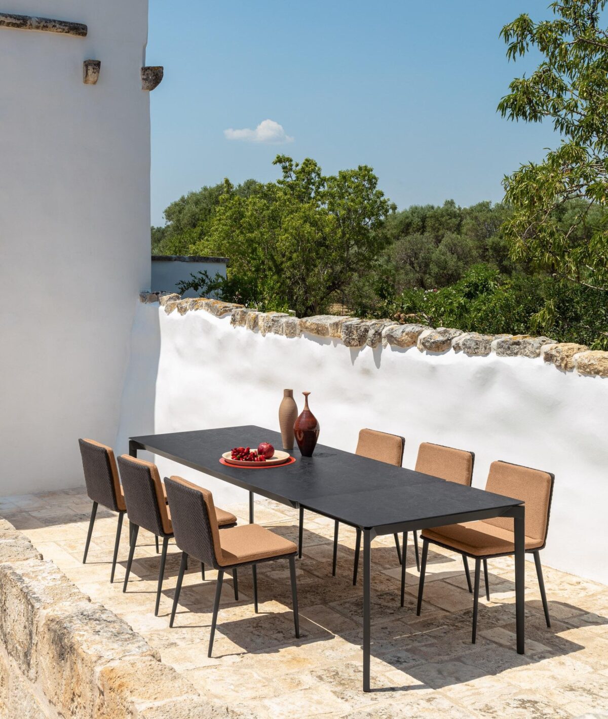 Luxury outdoor Leaf Dining Chair from Talenti with leaf-patterned back and sleek legs for Troy, Michigan homes