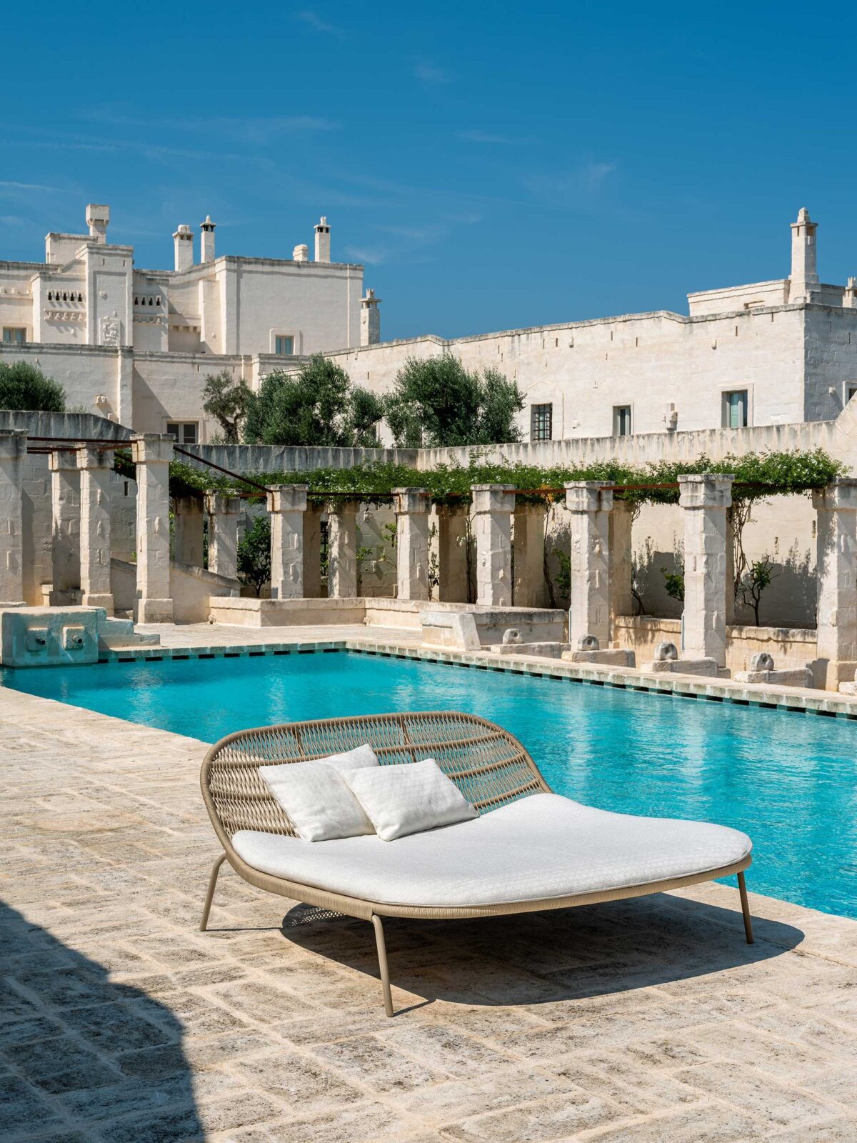 Designer Talenti Panama Egg Chair with fixed base and hand-woven rope for upscale exterior environments