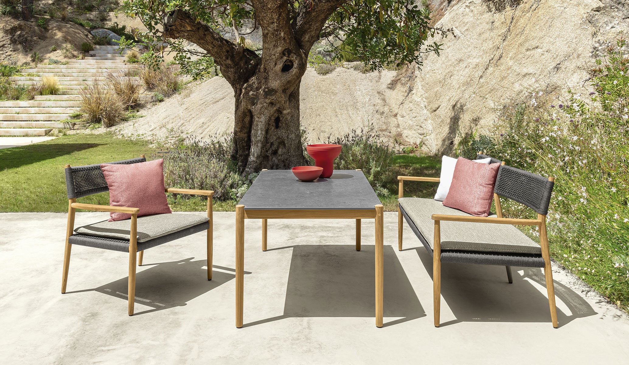 Dolcevita Love Seat by Talenti in natural teak with elegant beige cushions