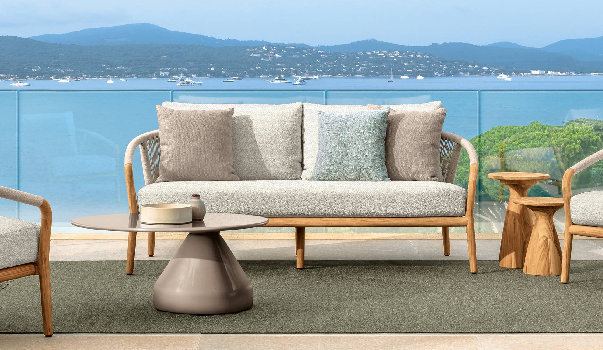 Parker Sofa by Talenti, featuring a teak wood frame and curved armrests for a modern and elegant design.