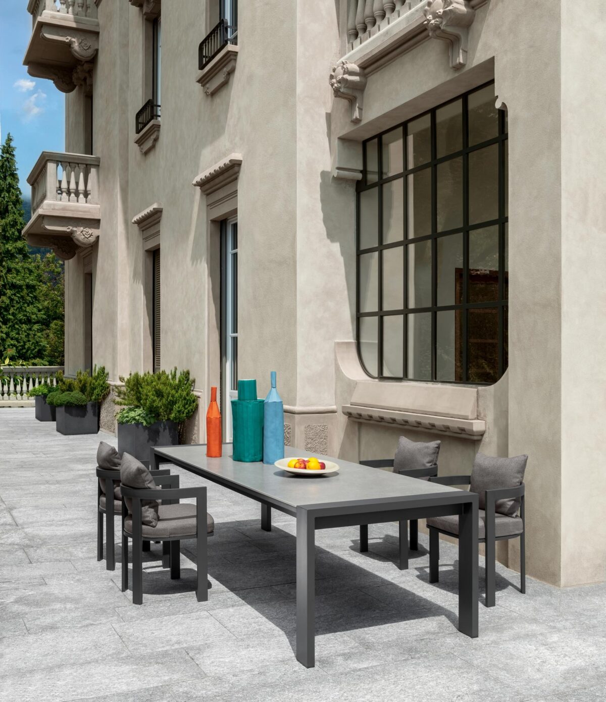 Talenti Argo Alu Dining Armchair featuring minimalist lines and weather-resistant cushions for Royal Oak, Michigan patios