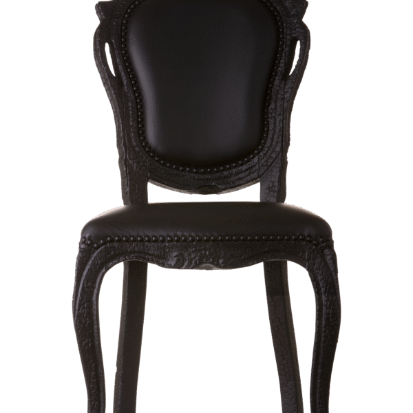 Smoke Dining Chair by Moooi, designed by Maarten Baas, featuring a burnt wood frame and epoxy resin finish.