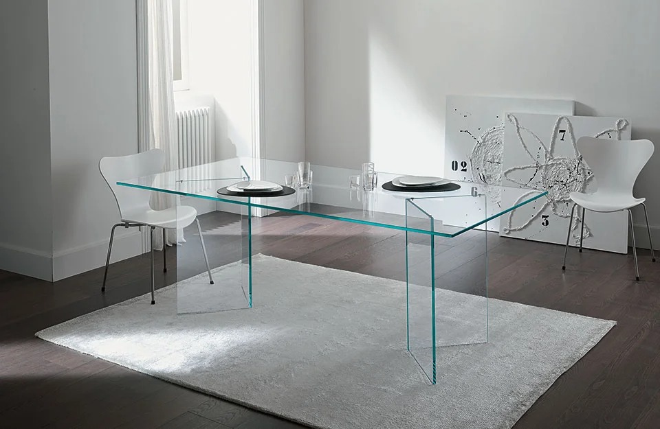 Bacco glass dining table by Tonelli Design in extra-clear finish, featuring mirrored glass supports, displayed in Royal Oak, Michigan.