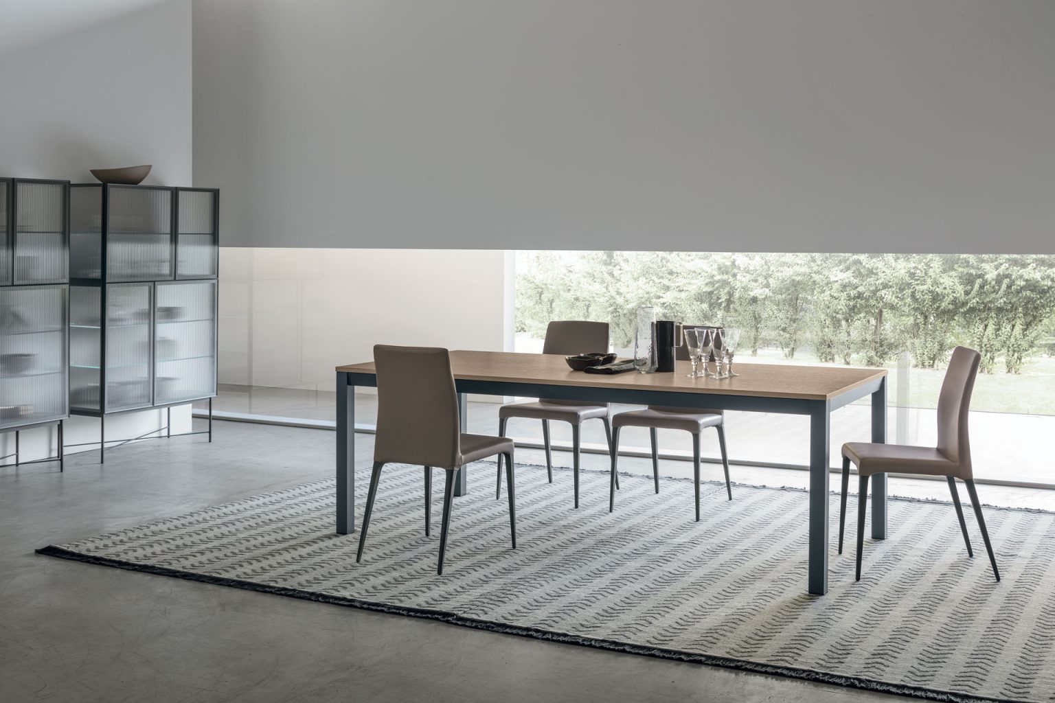 “Infinity table by Tomasella – modern Italian dining table with continuous loop-style base and refined contemporary design”