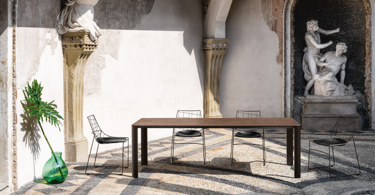 “Sovet Keyah collection – contemporary tables featuring bold architectural legs and refined Italian craftsmanship”