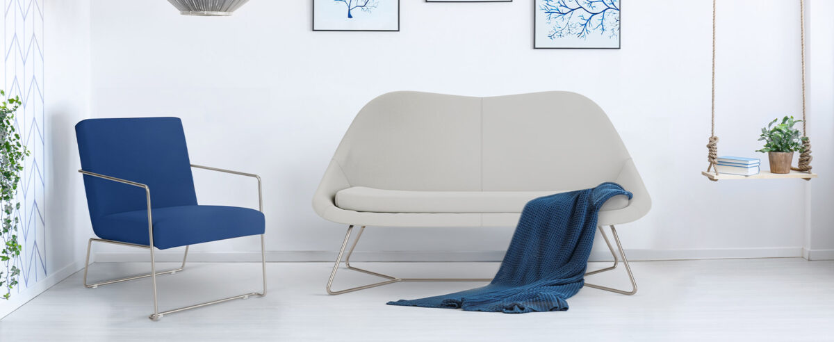 “Muir by Via Seating designer guest chair with polished frame in Birmingham Michigan showroom”