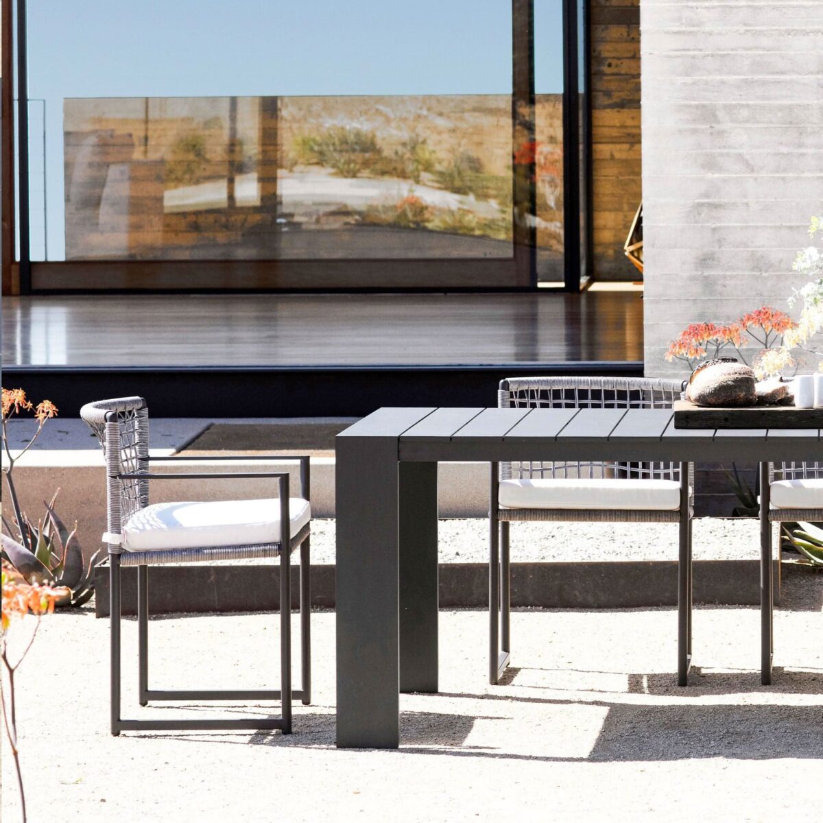 “Loop Dining Chair by Harbour – modern outdoor chair with woven rope back and teak legs”