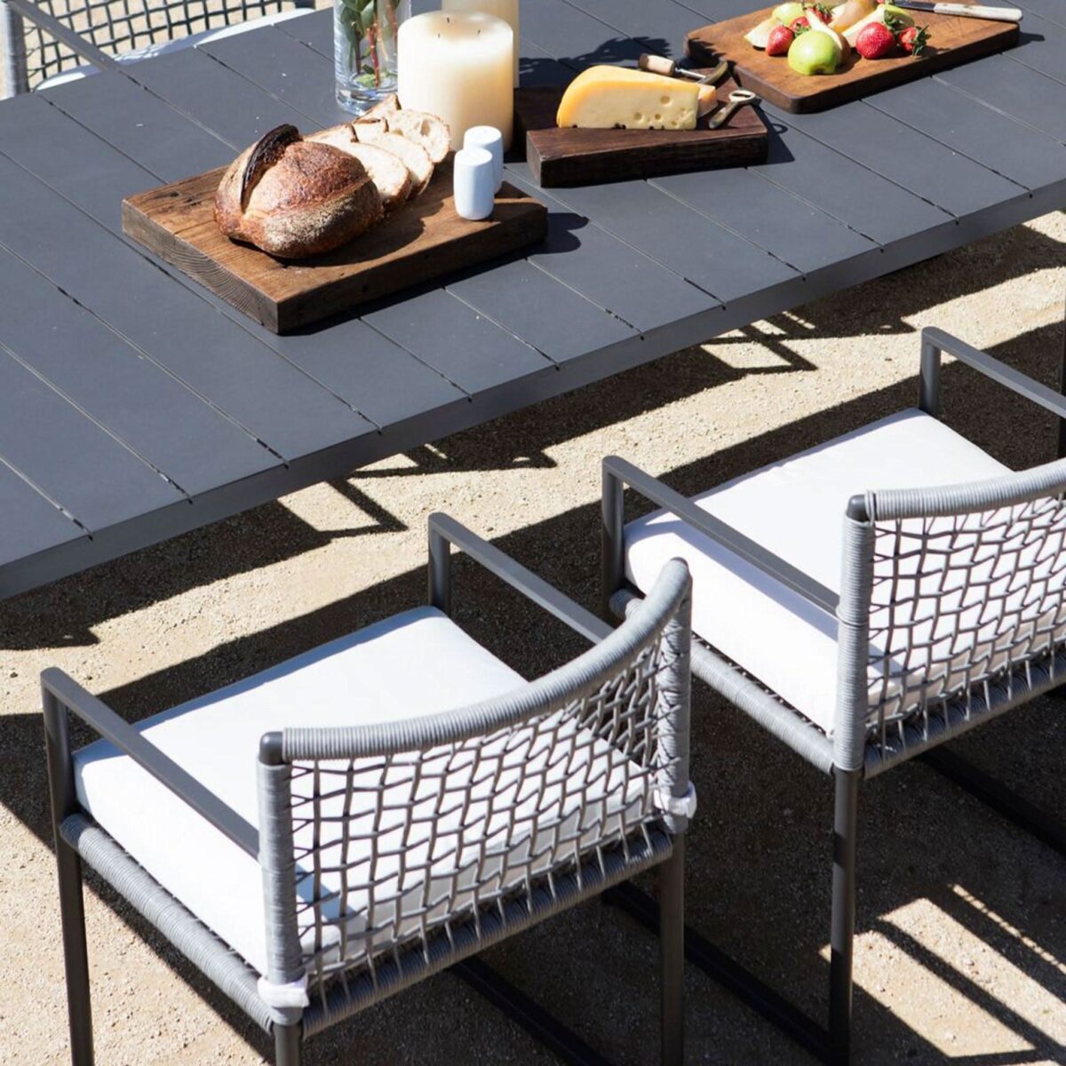 “Close-up of Loop Chair – handwoven rope detailing and natural teak base for elegant outdoor seating”