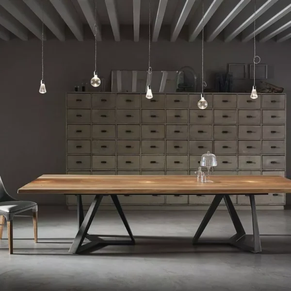 Close‑up of Millennium XXL by Bontempi highlighting joined X‑frame metal bases and smoked-grey extra-clear glass top.