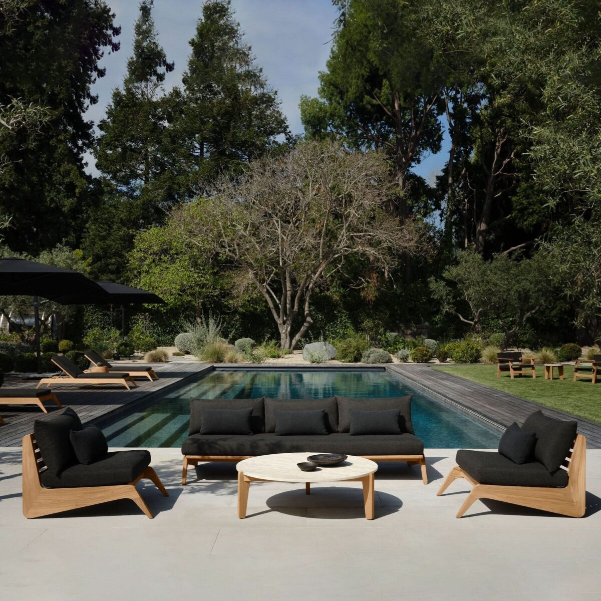 “Designer teak easy chair – Harbour MLB collection with sculpted wood base and deep comfort”