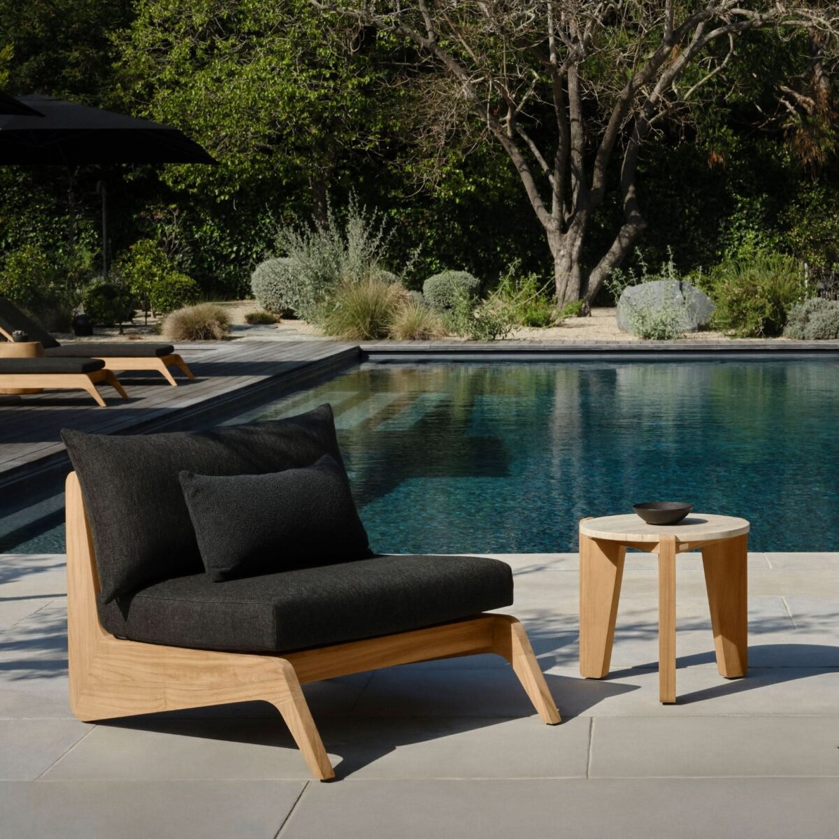 “MLB Teak Lounge Chair – modern resort-style outdoor chair by Harbour with low-profile frame”