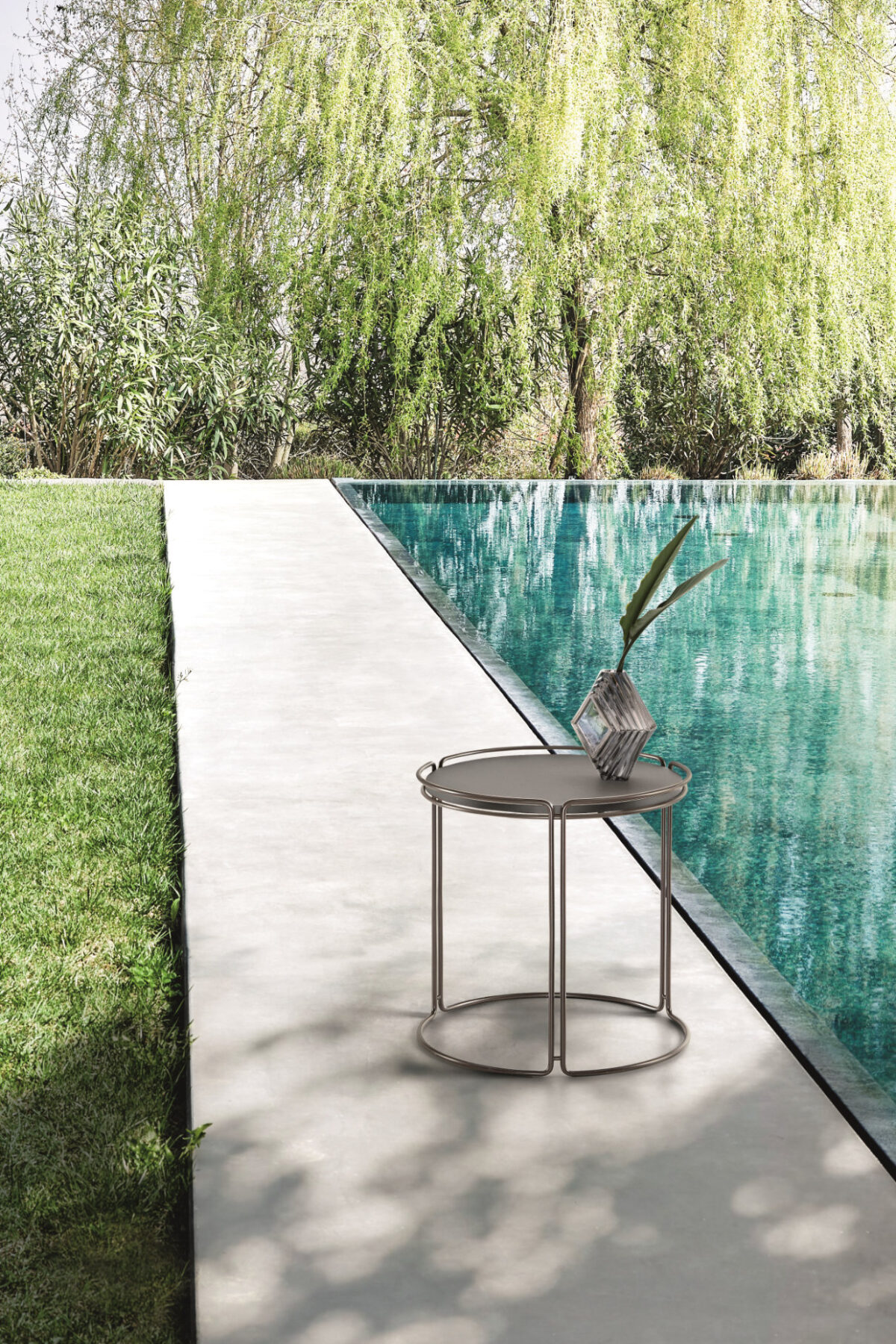“MONOLITH garden coffee table by Ditre Italia – contemporary low table featuring minimalist lines and strong visual presence”