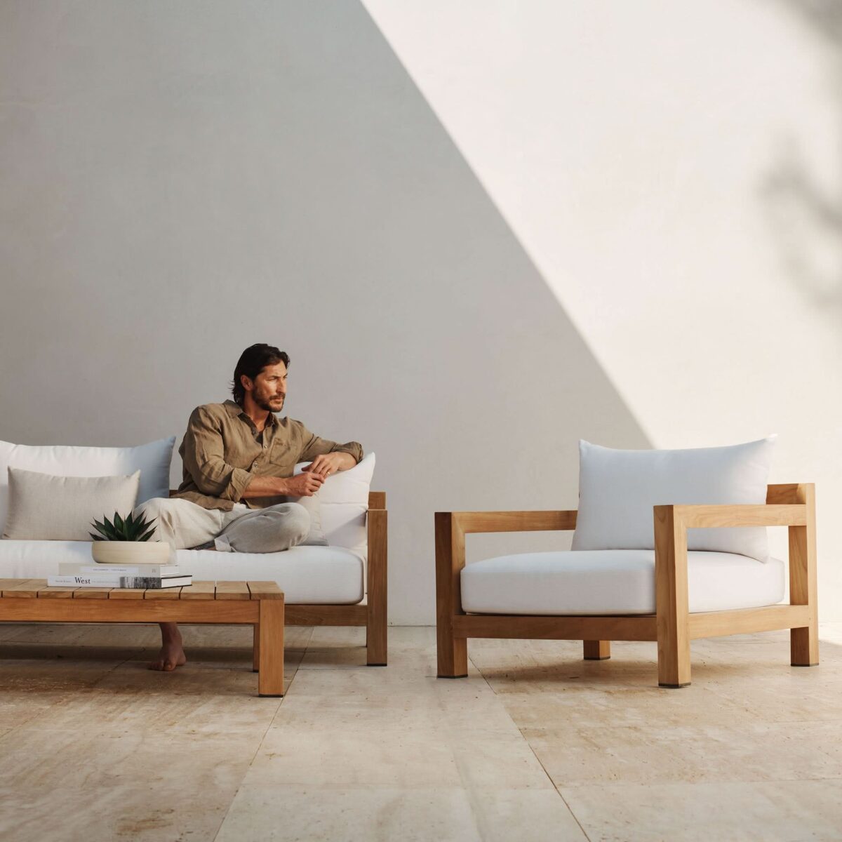 “Back view of Pacific Teak 3 Seat Sofa – sleek and durable outdoor design in solid wood by Harbour”