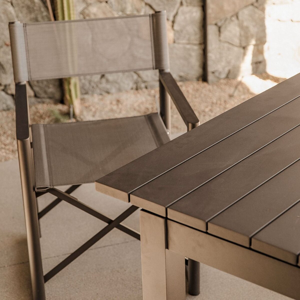 “Angled shot of Pacific extendable dining table – weather-resistant modern patio furniture”
