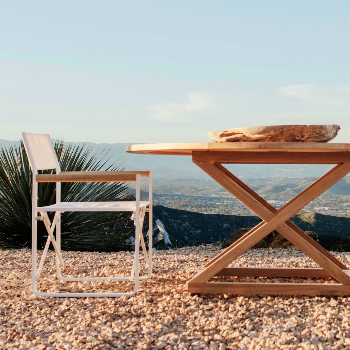 “Pacific collection teak dining chair by Harbour – minimalist silhouette with natural teak grain and outdoor durability”