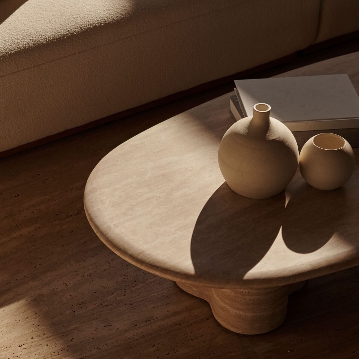 “Close-up of Porto Travertine Pill Coffee Table – soft curves and refined textures in natural materials”