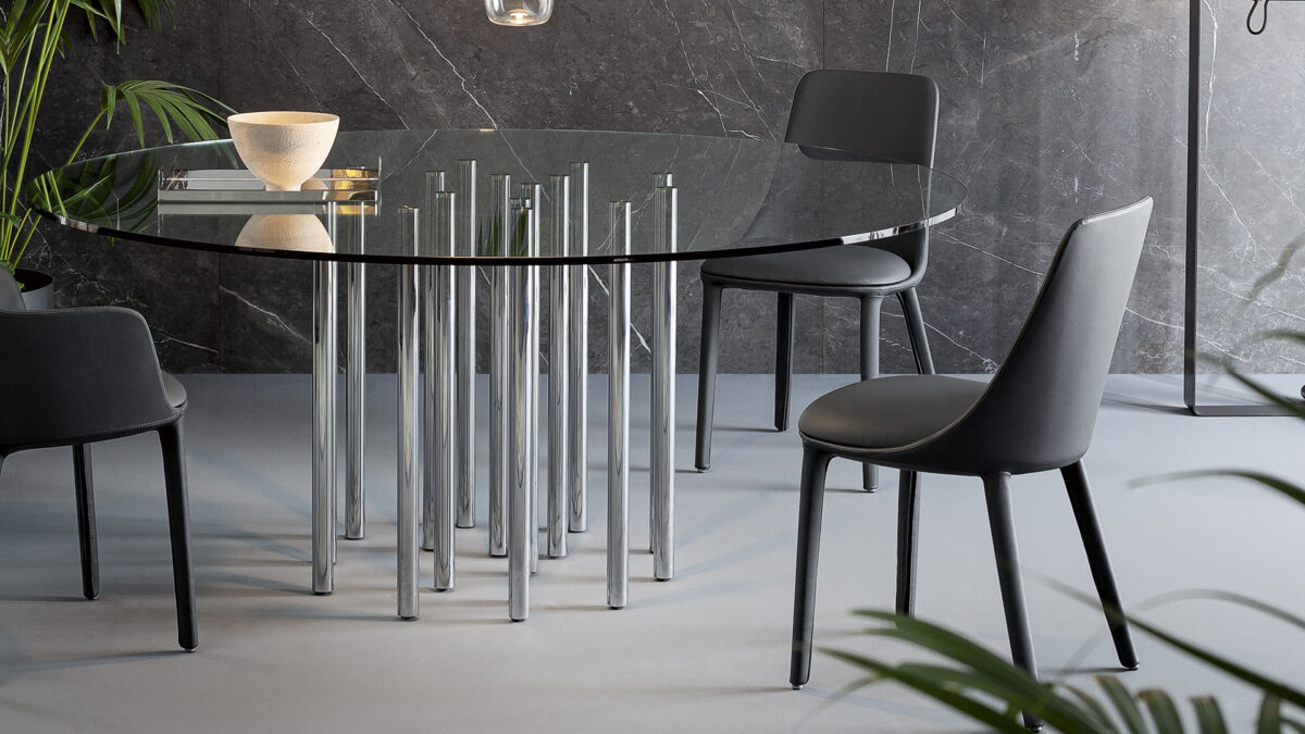 "Miss Record chair with armrests and slender metal base in contemporary living space."