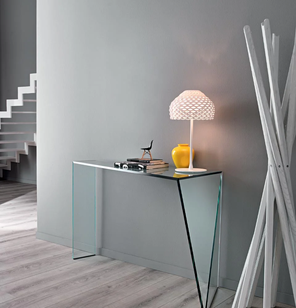 Penrose Console by Tonelli Design with transparent glass structure and asymmetric design, displayed in Royal Oak, Michigan.