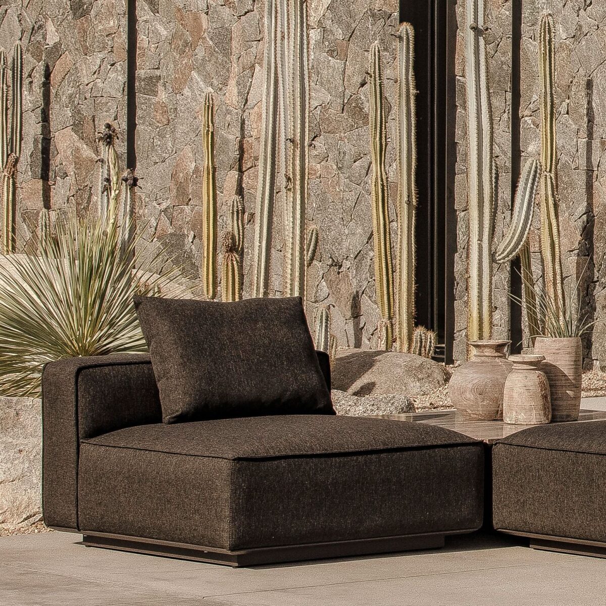 “Outdoor arrangement featuring Santorini Armless Single – versatile piece for modern patio settings”