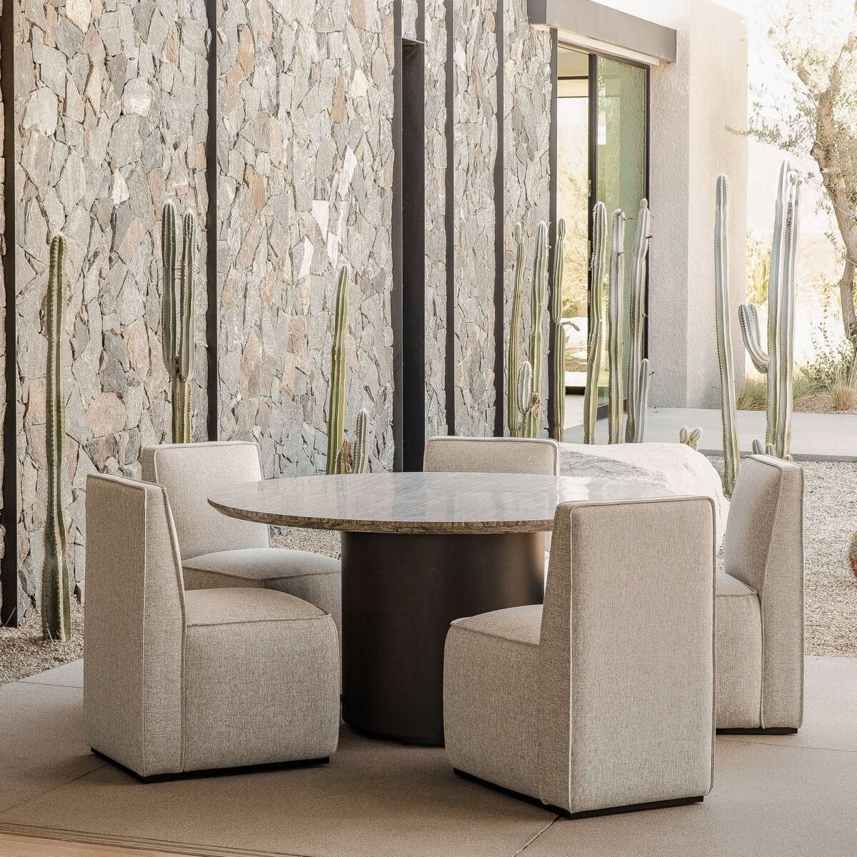 “Modern 60-inch outdoor stone dining table – Santorini round table by Harbour for patios and terraces”