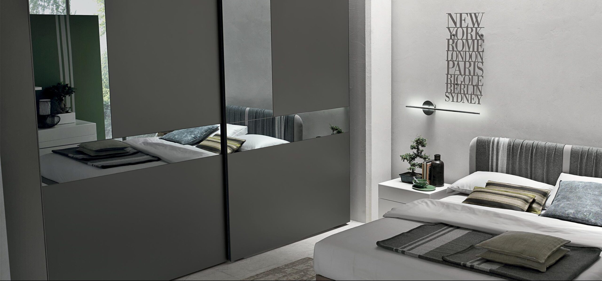 “Cristal Sliding wardrobe by Tomasella – modern Italian wardrobe with glass sliding doors and minimalist aluminum profiles”