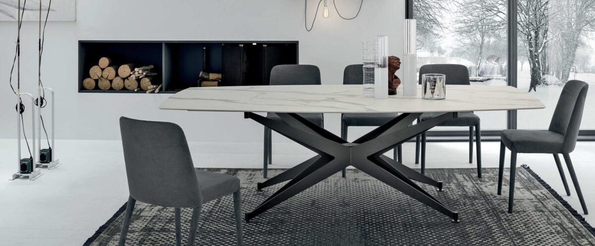 “Tomasella Halley collection – refined dining tables featuring bold angular legs and sleek tabletop finishes”