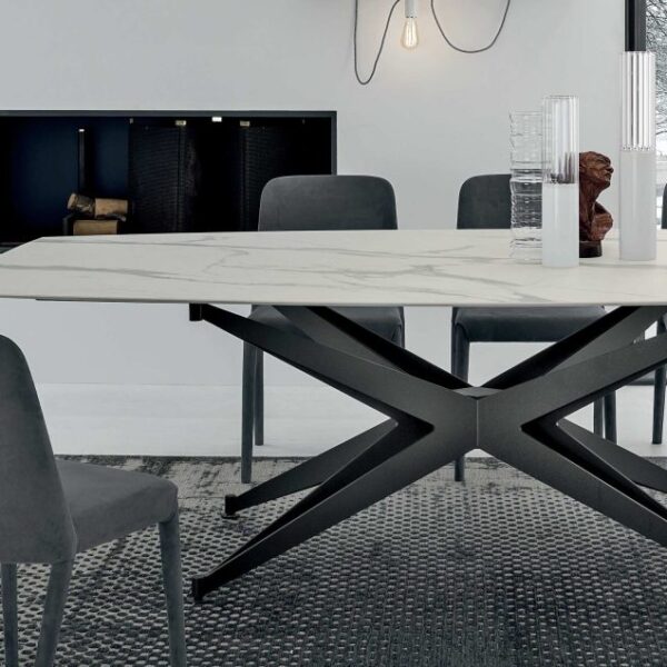 “Tomasella Halley collection – refined dining tables featuring bold angular legs and sleek tabletop finishes”