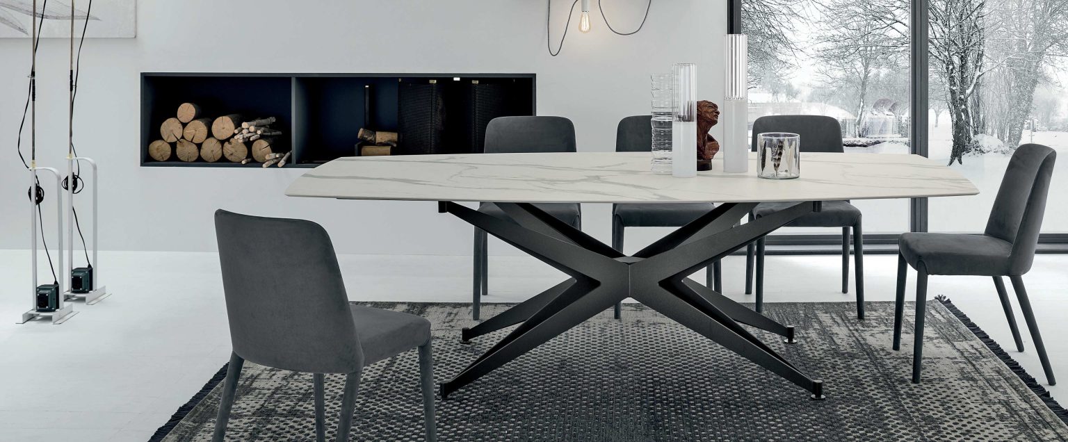 “Tomasella Halley collection – refined dining tables featuring bold angular legs and sleek tabletop finishes”