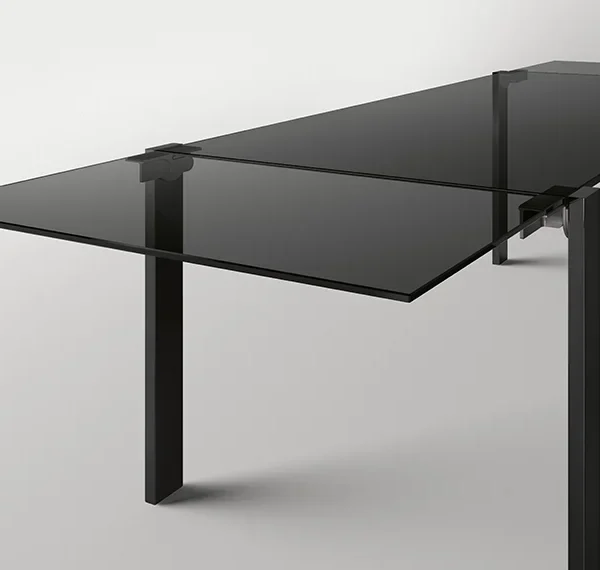 Livingstone Dark extending dining table by Tonelli Design with stratified smoked glass top and Siberian Ash wood legs, displayed in Royal Oak, Michigan.
