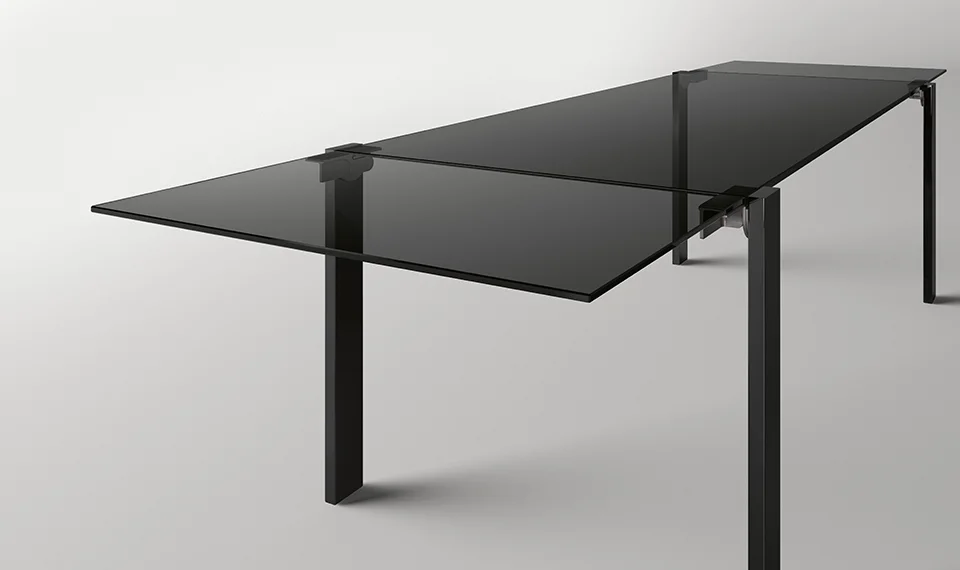 Livingstone Dark extending dining table by Tonelli Design with stratified smoked glass top and Siberian Ash wood legs, displayed in Royal Oak, Michigan.