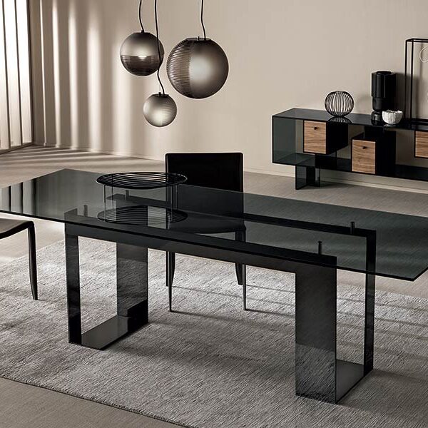 Miles dining table by Tonelli Design with extra-clear glass top and black lacquered metal base, displayed in Royal Oak, Michigan.