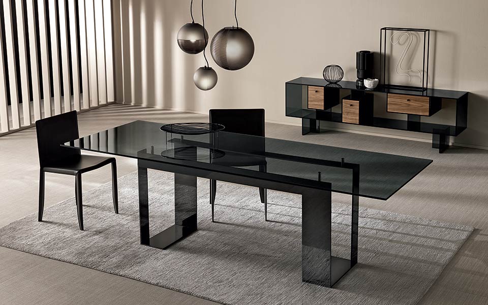 Miles dining table by Tonelli Design with extra-clear glass top and black lacquered metal base, displayed in Royal Oak, Michigan.