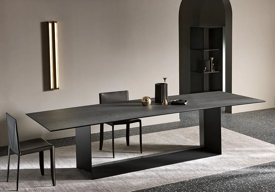 T5 dining table by Tonelli Design with extra-clear glass top and brushed gold metal base, displayed in Royal Oak, Michigan.