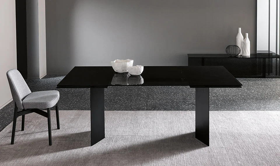 High table T-AB by Tonelli Design with dark smoked glass top and brushed bronze metal base, displayed in Royal Oak, Michigan.